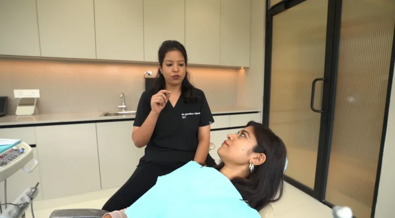 Explaining the treatment plan before starting - Dr. Spandanas Dentistry - Dr. Spandanas Dentistry Dentist explaining a treatment plan to a patient reclining in a dental chair